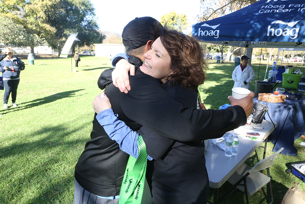 Mindy Mordecai hugging a supporter of ECAN